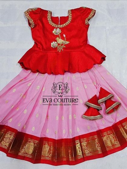 This red and pink peplum Pattu Pavadai is a ready-to-ship item, perfect for a baby's first festival.