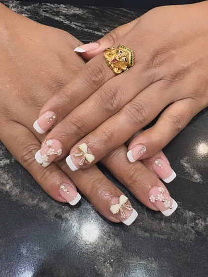 This design proves that classic can also be cute. We gave the timeless French manicure a playful twist with delicate 3D bows and tiny pearl accents, creating a look that is both sophisticated and charming for any special occasion.