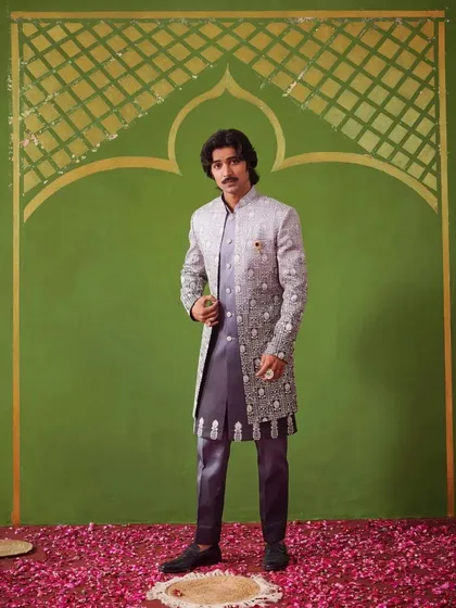 The model strikes a confident pose in the grey Indo-Western suit. The Nazaakat collection is all about blending modern trends with traditional grace.