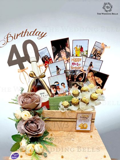 Cheers to 40 fabulous years. This luxury birthday hamper was designed for a milestone celebration, featuring a bottle of wine, ferrero rocher bouquet, and a collage of memories.