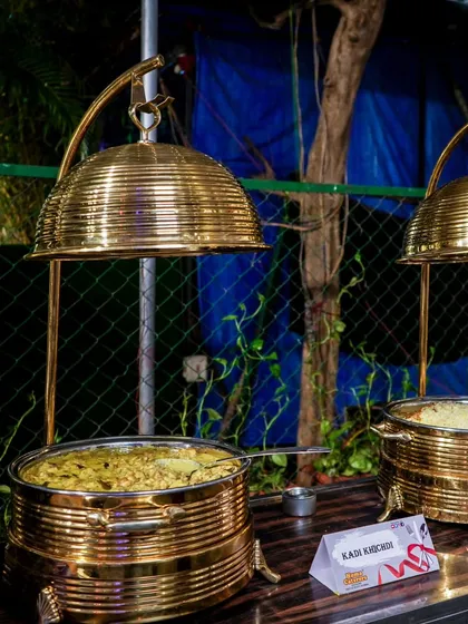 A close-up of our Kadi Khichdi station, presented in our signature brass serveware that keeps the food hot and looks magnificent.