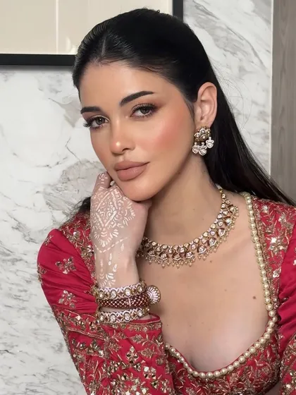 Another angle of the "less is more" soft glam look. The white henna adds a unique, modern touch to this editorial style.