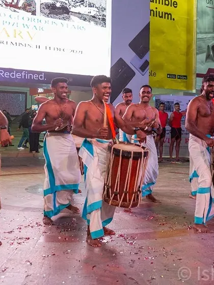 Photographing the rhythmic procession of traditional Chenda Melam drummers. Capturing movement and cultural details is a specialty I bring to public event coverage.