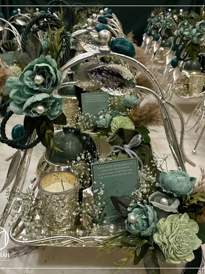 A wider view of the Gilded Grove trays, showcasing how they look when prepared for a large wedding event. The consistent theme and color palette create a stunning display of gratitude for guests.