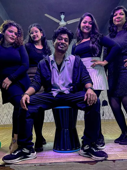 Posing with some of my dedicated students. We build strong bonds in our classes and grow together as a dance family.