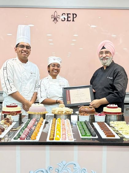 Another proud moment from my graduation, receiving my certificate. The table is filled with all the beautiful pastries and cakes we learned to create during the course.