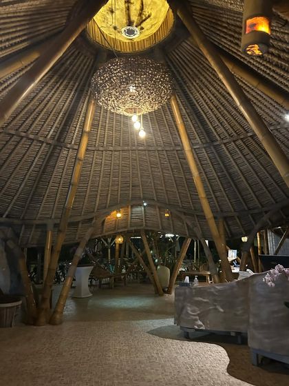 The soaring, cathedral-like roof of this bamboo structure in Bali is both awe-inspiring and deeply connected to nature.
