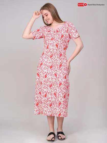 A cheerful, front-facing shot of a model in a printed summer dress. We focus on capturing expressions that match the brand's vibe, making the product more relatable.