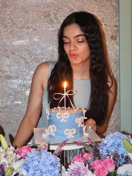 Our founder, Reeth, making a wish and blowing out the candle on her beautiful birthday cake, which was chosen by all of you.