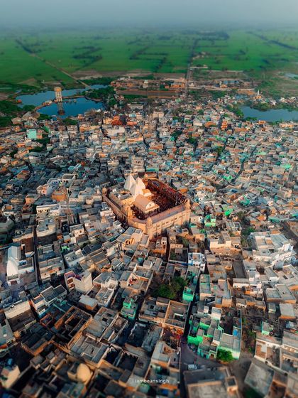 An aerial view of Nand Bhavan in Nandgaon, the historic residence of Lord Krishna's foster father. This drone shot captures the temple complex where the famous Lathmar Holi celebrations take place.