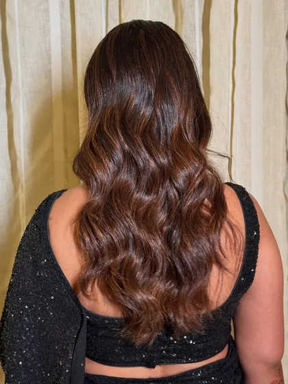 Soft, glamorous waves for a cocktail or reception look. This hairstyle is all about volume and movement, perfect for a night of dancing.