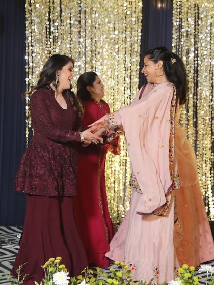 The bride's tribe, a mix of sisters and cousins, having a blast during their performance.