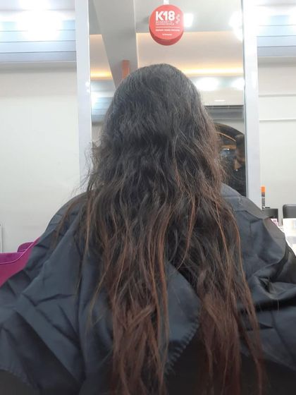 The "before" shot of a client ready for a haircut. It's the perfect canvas for a fresh new style.