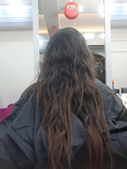 The "before" shot of a client ready for a haircut. It's the perfect canvas for a fresh new style.