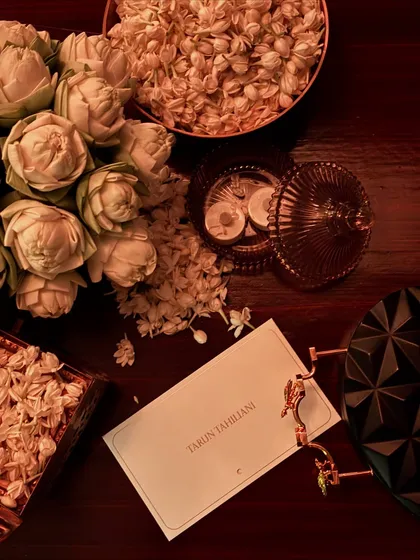 The details matter. An invitation and accessories from a Tarun Tahiliani show, a designer known for his impeccable craftsmanship and modern take on Indian heritage.