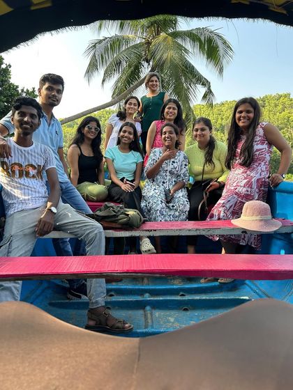 A candid shot of our travelers enjoying the boat ride in the backwaters, soaking in the sun and scenery.