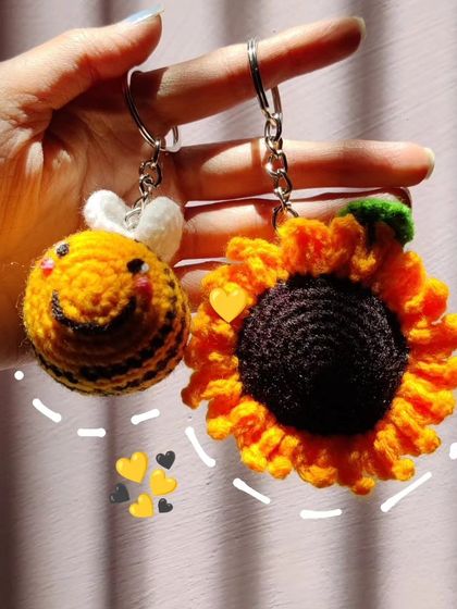 My super popular bumblebee keychains. They come in the classic yellow and black, but I also make them in fun colors like pink, blue, and purple.