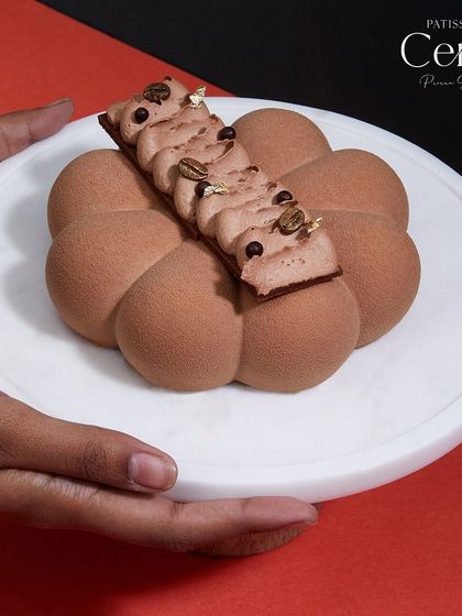 My Mochaccino entremet, presented to be enjoyed. The flower-like shape and detailed piping make it a centerpiece dessert for coffee and chocolate lovers.