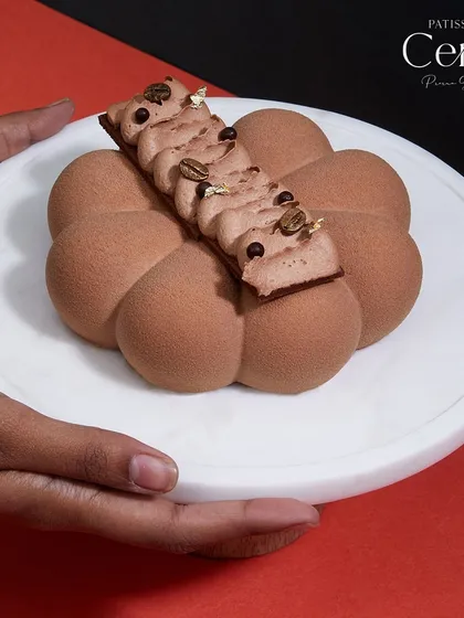 The Mochaccino, presented as a piece of edible art. It perfectly balances bold espresso with rich, creamy cocoa.