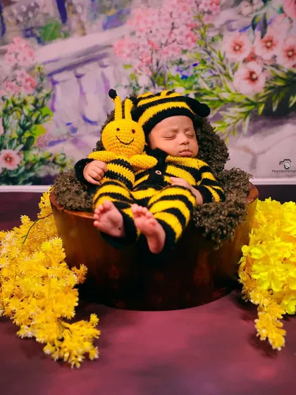 I capture the precious first moments of your little one's life. With adorable, baby-safe props and costumes like this bumblebee outfit, I create heartwarming newborn portraits in a comfortable studio environment.