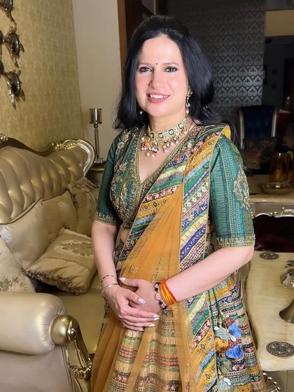 The final look for the mother of the bride, radiant and confident in her beautiful multi-colored lehenga.