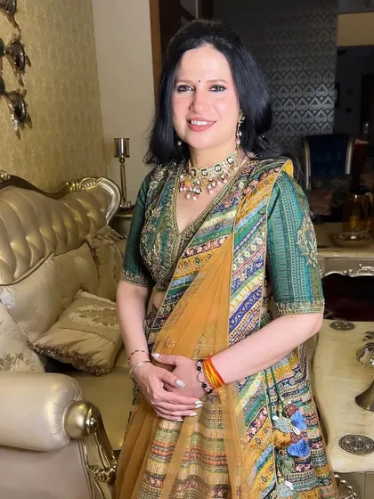 The final look for the mother of the bride, radiant and confident in her beautiful multi-colored lehenga.