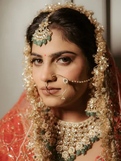 A bride's gaze holds a universe of stories. This close-up portrait is all about capturing the quiet strength, anticipation, and timeless elegance of Ananya just moments before she walked down the aisle.