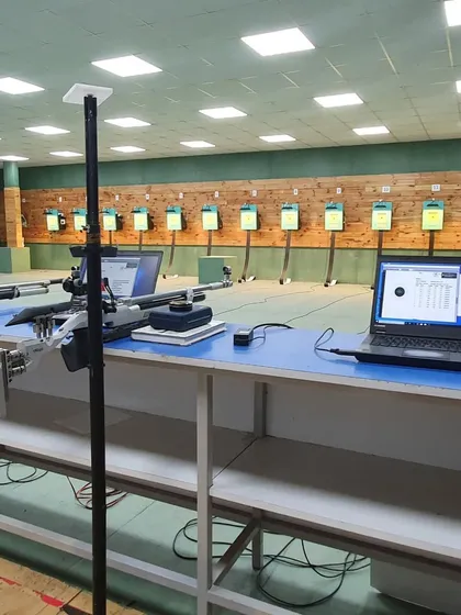 Another look at our range setup, showing the professional grade rifles and electronic scoring systems that our athletes train with every day.
