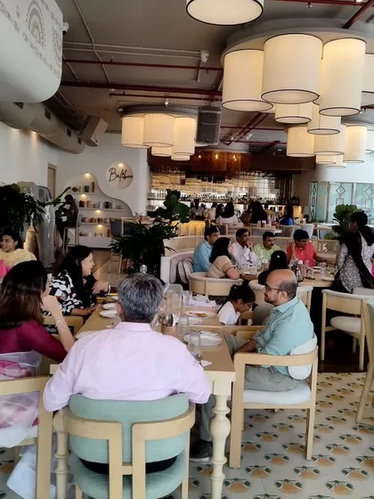 The beautiful restaurant setting for a 10th-anniversary party I hosted. I am comfortable hosting in various venues, from banquet halls to restaurants, adapting my style to the environment.