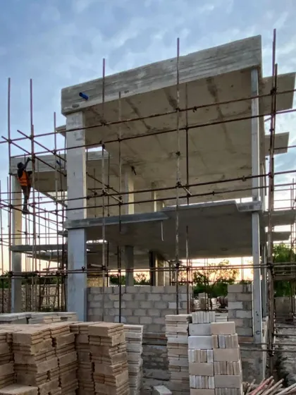 The concrete columns, beams, and slabs are complete for phase two at Kizikula. This raw structure provides the framework for the subsequent layers of local materials and finishes that will define the project's character.