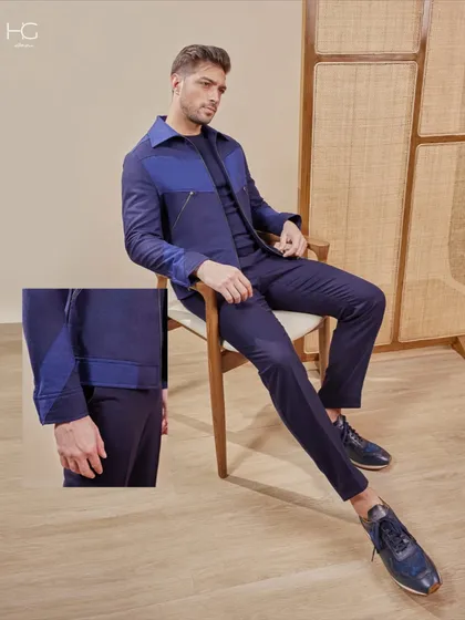This stylized overshirt set in a deep navy blurs the lines between refined and relaxed. It's an example of a complete, tailored look that is perfect for dinners, after-parties, or your next getaway, designed to move with you.