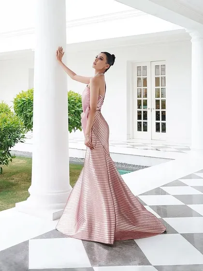 The clean lines and metallic sheen of this Amit Aggarwal gown are perfect for a sophisticated, modern look. I styled this for a client seeking understated elegance with a futuristic twist.