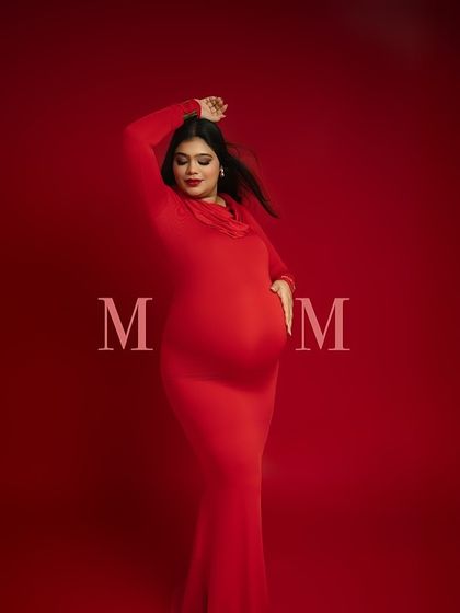 A modern tribute to motherhood. The simple "MOM" text overlay on this powerful pose in a red gown turns a beautiful portrait into a bold declaration. It's a celebration of the new identity you are embracing.