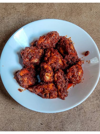 My version of the classic Chicken Ghee Roast, originating from Kundapura. The chicken is cooked in a rich, tangy masala with generous amounts of ghee until it's tender and flavourful.