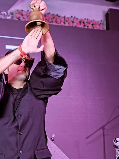 A guest enjoying the music at a Diwali party. Capturing the joy of the attendees is just as important as photographing the hosts.