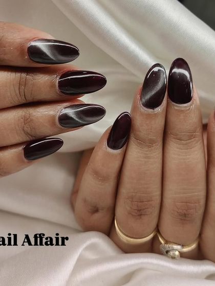Another view of the rich burgundy cat eye nails.
