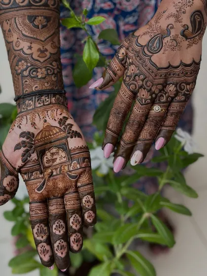 Another view of the maternity mehendi, showing the intricate details on the fingers and the beautiful flow of the design.