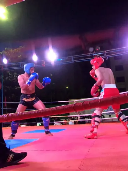 Subhan Ansari fighting for silver in the low kick category, showing great heart against a tough opponent.