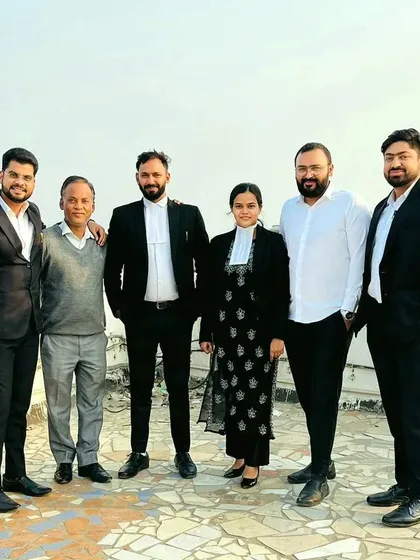 A professional group photo with my colleagues. The mix of black and white attire symbolizes our identity as advocates.