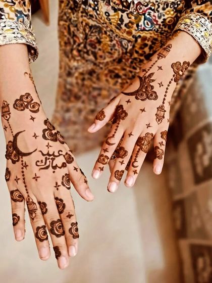 A whimsical and modern Eid design featuring moons, clouds, stars, and hanging lanterns. The "Eid Mubarak" in beautiful calligraphy adds a special festive greeting.