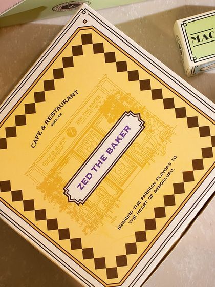 A close-up of the detailed design on my pastry boxes, inspired by the charm of classic French cafés.