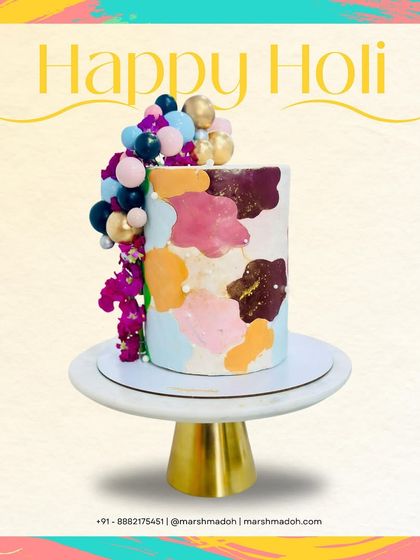 A splash of colours, a burst of flavours! This tall, modern cake was inspired by the vibrant festival of Holi, featuring abstract patches of colour and a fun balloon cascade.
