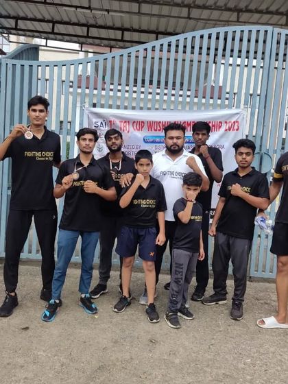 The team outside the venue of the 7th Taj Cup Wushu Championship.