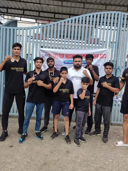 The team outside the venue of the 7th Taj Cup Wushu Championship.