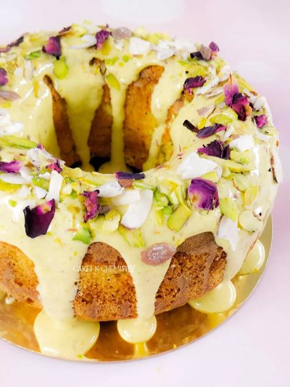 This Thandai tea cake is a bestseller during Holi. It's a moist, flavorful cake infused with traditional Thandai spices and topped with a delicious glaze, pistachios, and rose petals.
