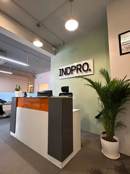 The reception area at Indpro's Bangalore office, where we introduced an Areca Palm to soften the modern design. A touch of green at the entrance creates a welcoming and refreshing first impression for employees and visitors.