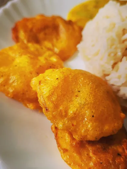 Another view of the golden-brown Aloo Pakoras, perfect for dipping into the tangy kadhi.