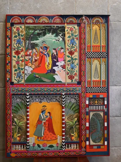 A salvaged camphor wood panel, once forgotten, is now a canvas for Krishna's tales. Through meticulous restoration and a combination of hand-painting and digital artistry, this architectural fragment has been transformed into a piece of fine art, rich with narrative and color.