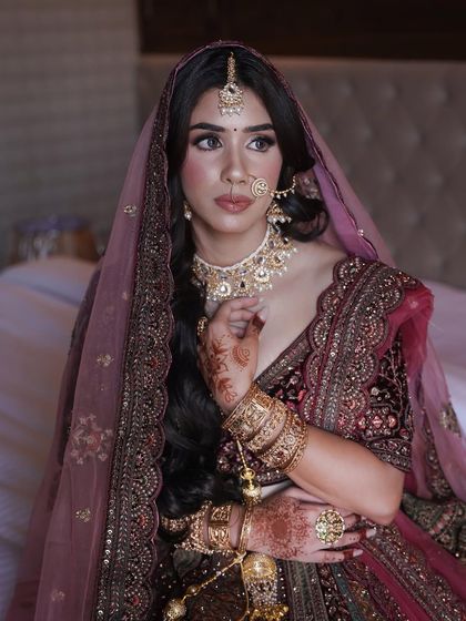 A portrait of this stunning bride. I focused on creating a soft, matte eye look and a defined lip to balance the heavy velvet fabric and intricate jewellery.
