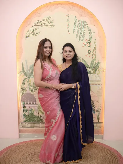 A full-length photo with a student on her graduation day, celebrating her hard work and success.